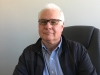 Karl Peters as Sr. Sales Engineer in the Industrial Optics Division.